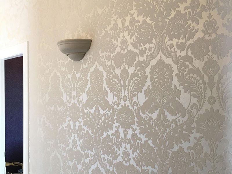 Elegant wallpaper on wall.